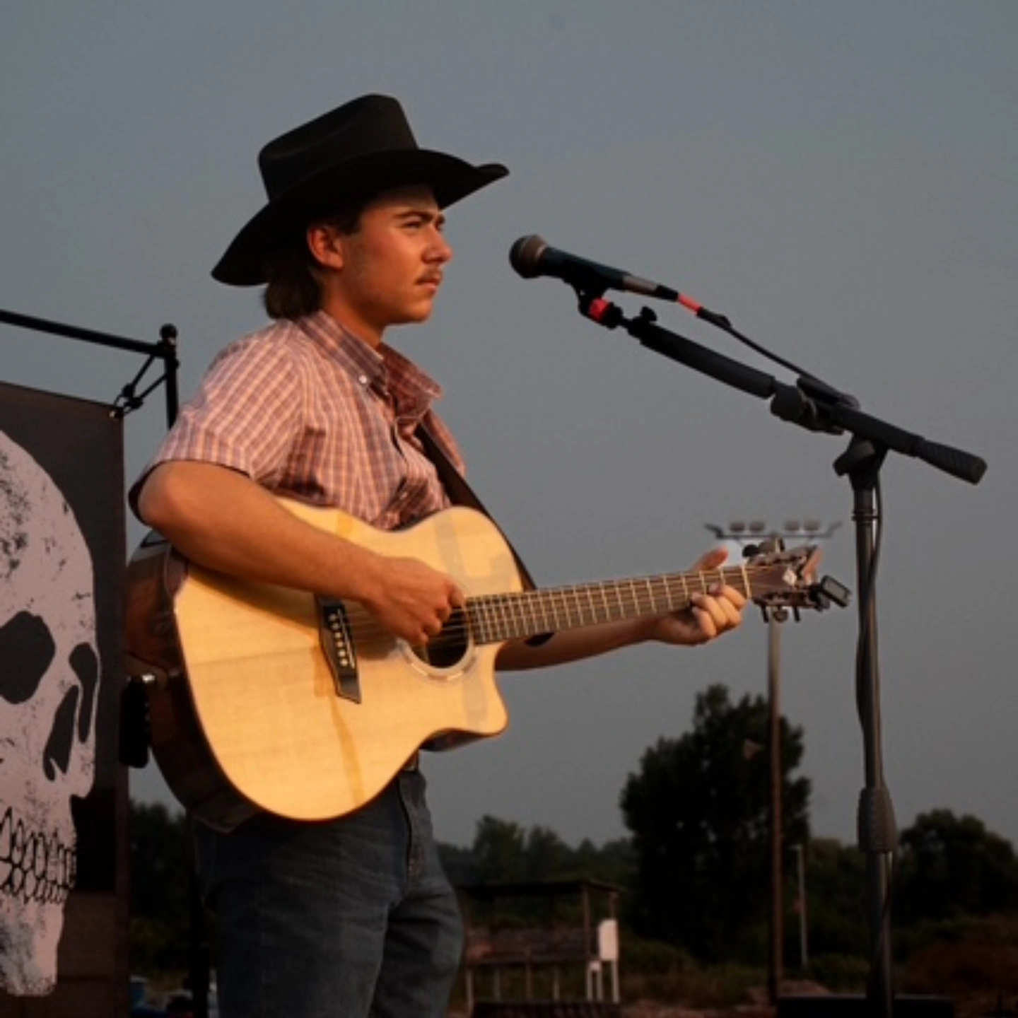 Dylan Soules performing with guitar